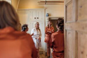 Girls in matching dressing gowns in the farmhouse kitchen